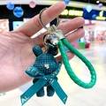 Teal woven bunny keychain with green leather strap, silver bell, and gold keyring - Green Rabbit