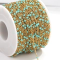 Detail of gold stainless steel flat cross chain with light blue enamel beads for DIY jewelry - Gold Chain Green Beads