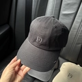 Close-up of black cotton baseball cap featuring FD embroidery and reinforced stitching - Black