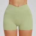Sage green cross-waist yoga shorts with side pockets and high-rise athletic design - Bean Green