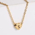 Polished 18k gold plated heart necklace featuring a black engraved letter S - S