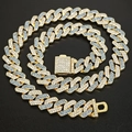 Macro shot of gold Cuban link necklace with alternating blue and clear inlaid crystals - Medium Clasp Half Blue Gold