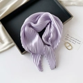 Detailed view of light purple pleated silk scarf arranged on a black tray with props - 70*70cm / Pleated Light Purple