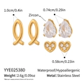 Detail view of 3-pair gold earring set with zircon fish, pear, and heart shape studs - Fish Pear Heart Zircon Set (YYE025380)