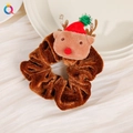 Detail of plush brown velvet reindeer scrunchie with Christmas hat on white fabric - Christmas Cartoon Scrunchie - Reindeer A