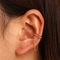Elegant 18K gold double hoop ear cuff with delicate chain tassel on model's ear - Double Circle Long Chain Style (WG-0264)