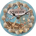 Silent ocean theme wall clock with blue wood grain dial and decorative seashells - Ocean View Window