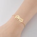 Elegant gold letter plate bracelet for women featuring a minimalist thin metal chain design - 338-Letter Plate