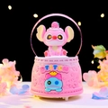 Pink Angel music box featuring a Stitch character design and light-up base decoration - 2434 Pink Base / Medium Size 80 With Snow Lights And Music