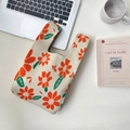 Knitted tote bag in cream white with vibrant orange floral patterns for daily commute - Orange Daisy