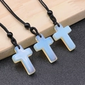 Three-piece set of translucent opalite cross pendants with black woven necklaces - Synthetic Opal