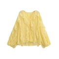 Close-up of yellow chiffon blouse featuring V-neckline and tiered ruffle layering detail - Yellow