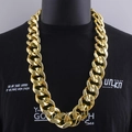 Chunky gold-tone hip hop cuban link necklace shown on a black tee display - 100cm Length / Gold
