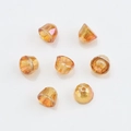 Detailed view of 8mm orange crystal bell charms with iridescent finish for jewelry making - Wine Red Plated
