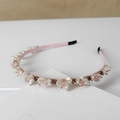 Detail of pink satin headband featuring crystal beads and faux pearls with soft lighting - Style SJ009 Flower / Pink