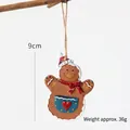 Gingerbread man Christmas tree ornament with red hat and blue heart pocket, 9cm height - Pocket Gingerbread Man