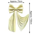 Macro detail of a large velvet bow decoration showing 75cm width and 150cm length - 75*150cm / Beige