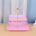 Detail of pink double-tier square dessert stand with floral reliefs and gold handle - 2-Tier Square Cake Stand, Pink with Gold Rod