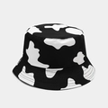 Detailed view of black and white cow print bucket hat showing fabric texture and neat stitching - Black and White Cow Print (1#色)