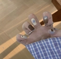 Detailed view of hand-painted brown and beige press-on nails with smudge effect - 30 Packs / Sea Salt Coffee
