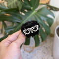 Detail of a black acetate puppy hair claw clip featuring white heart-shaped glasses - Heart Eyeglasses Black Puppy