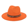 Detailed macro of orange straw fedora hat featuring black band with silver square studs - M (56-58cm) / Orange