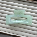 Macro shot of large green marble ink pattern shark hair clip on a velvet jewelry tray - Green Rectangle 10.5cm