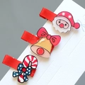 Detail of Christmas hair clips set with Santa, bell and candy cane on red ribbon - 3-Piece Christmas Hair Clip Collection