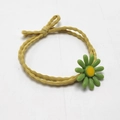 Elastic yellow hair tie with a green daisy flower charm and decorative knot detail - Yellow Rope with Green Flower