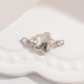 Macro shot of silver S925 sterling silver star-shaped connector clasp for DIY jewelry - Large Star Slide Clasp / White Gold