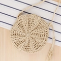 Minimalist beige round straw bag with long woven strap and decorative fringe tassel detail - Beige