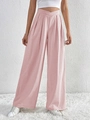 Detail of pink wide-leg trousers featuring a unique V-shaped cross waistband design - Pink