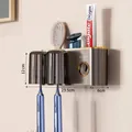 Wall-mounted dark grey toothbrush holder with gold trim and two magnetic mouthwash cups - 2-Cup Style + Toothpaste Squeezer-Gun Grey-Magnetic