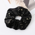 Close-up of black velvet scrunchie featuring elegant gold star patterns on a white background - Large / Black with Gold Stars