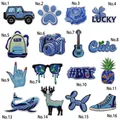 Macro detail of 16-piece blue embroidered patch set showing fine stitching and textures - Blue Series Patch Set