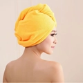 Absorbent yellow microfiber hair towel wrap shown on a model from a side profile view - 60*25cm 70g / Orange