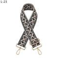 Close-up of ethnic jacquard wide strap with black geometric pattern and gold hardware - Black White Khaki