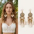 Detail view of Bohemian tassel earrings with metallic feathers and woven beads - White (45# Ear Hook-Gold)