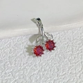 Detail view of a cherry pendant with red faceted crystals and zircon leaf on white surface - Style A Silver-Red (Round Cherry)
