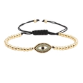 Bracciale regolabile con malocchio e perline dorate con dettagli in turchese su bianco - Oro
