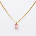 Macro detail of 18K gold snake chain with a rectangular pink zircon stone pendant - Pink Zirconia - Gold
