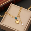 Golden heart necklace with blue gemstone and pearl detail on jewelry box - 1# Necklace