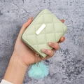 Pale green quilted faux leather coin purse with furry pom-pom and gold buckle - Green