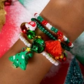 Close-up of Christmas themed red beaded bracelet set with bells and tassels on wrist - Tassel Christmas Tree(27634-colour)