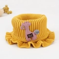 Yellow knitted baby neck warmer with a cute giraffe patch and button detail - Yellow Knitted Bib
