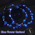 Detailed view of glowing blue LED floral wreath with bright rose flower ornaments - Blue