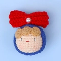 Handmade crochet doll head pendant with a red bow and white pearl in blue ring - MENGSI Red Bow Doll