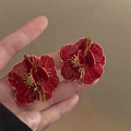 Vintage style red flower earrings with golden edges shown in hand for size scale - Red Vintage Wavy Petal Silver Needle Style (14#)