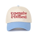 Close-up of Expensive & Difficult embroidery on a two-tone beige and blue baseball cap - Off-white/Light Blue