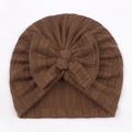 Close-up of dark brown knitted baby turban hat with a large bow detail and V-pattern - One Size / Coffee
